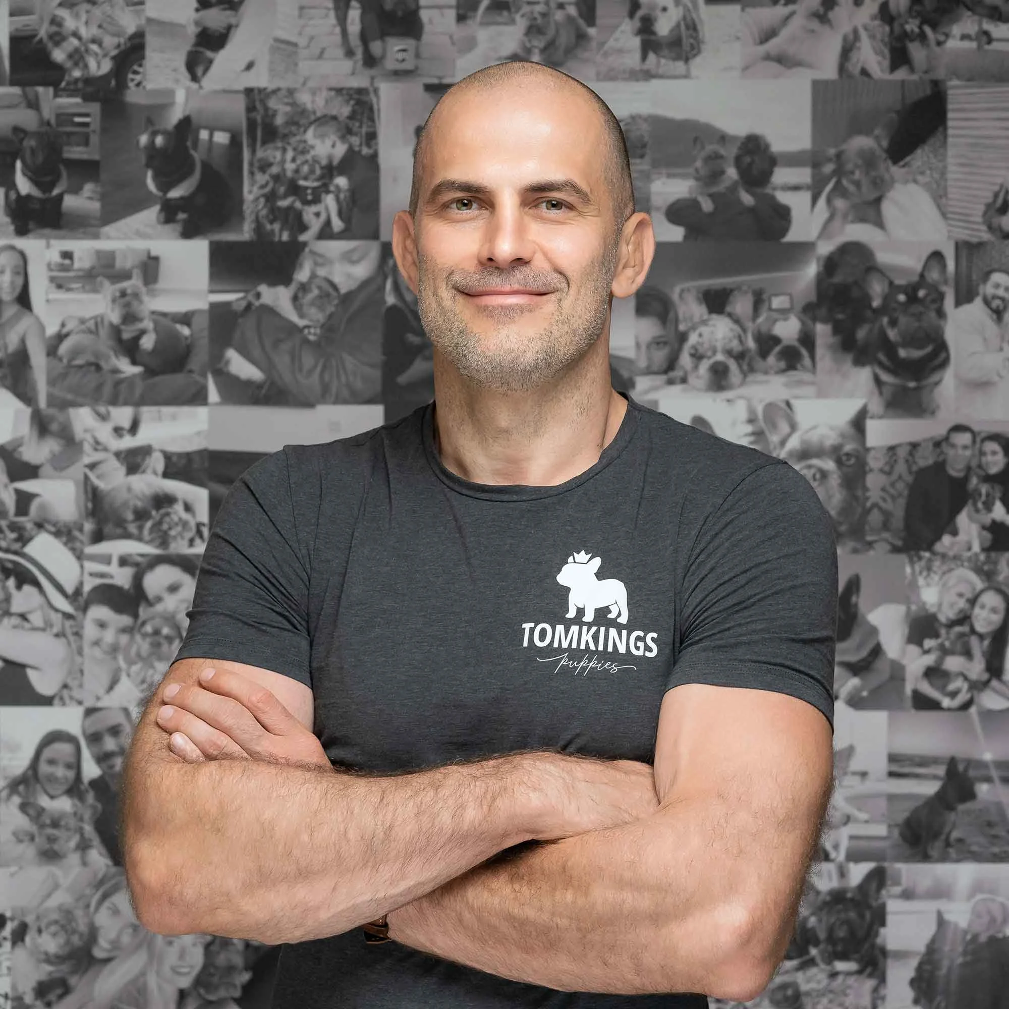 Geri, TomKings team member, standing arms crossed